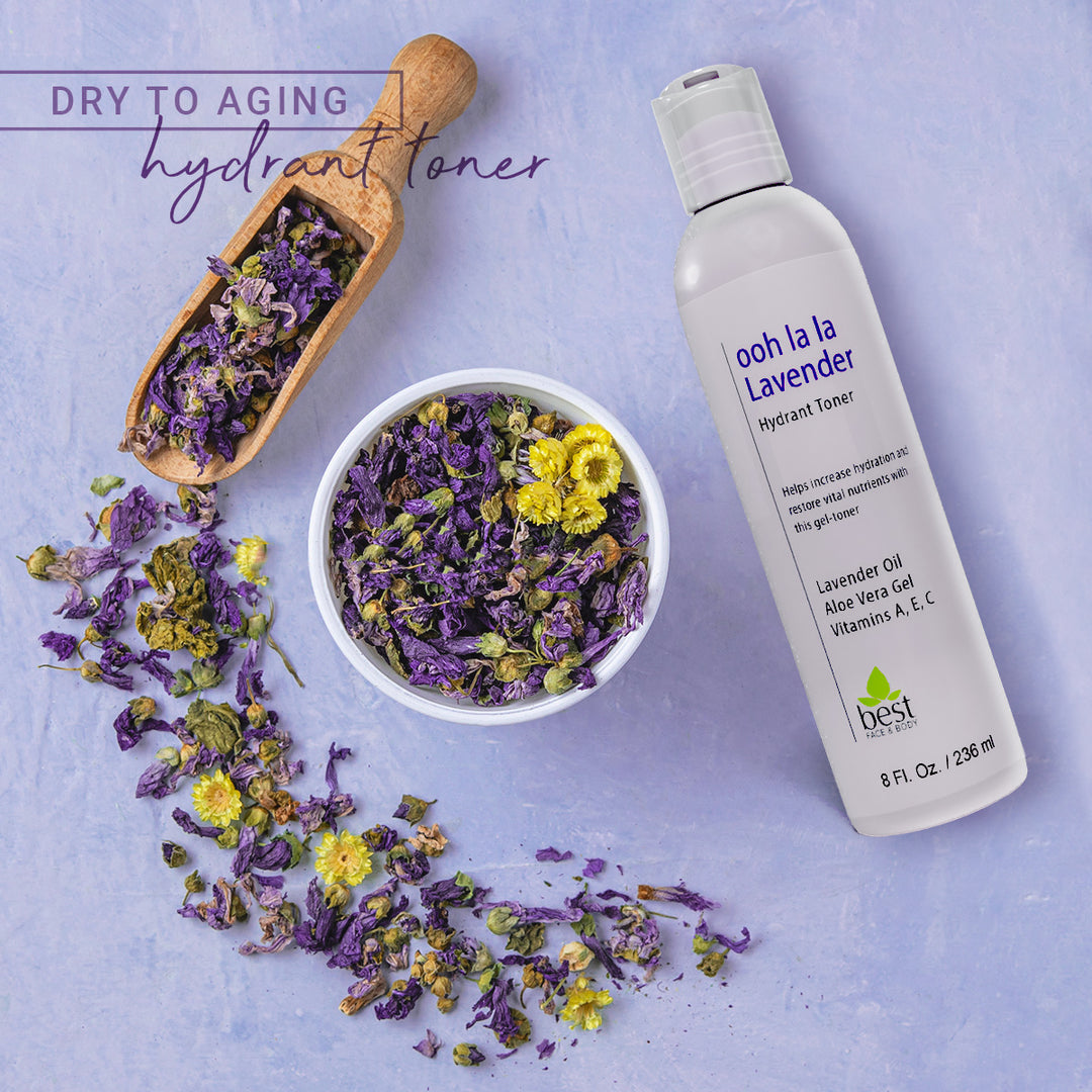 Ooh la la lavender Hydrant toner. Overhead image of 8oz bottle with bowl and scoop of dried chamomile and lavender herbs.