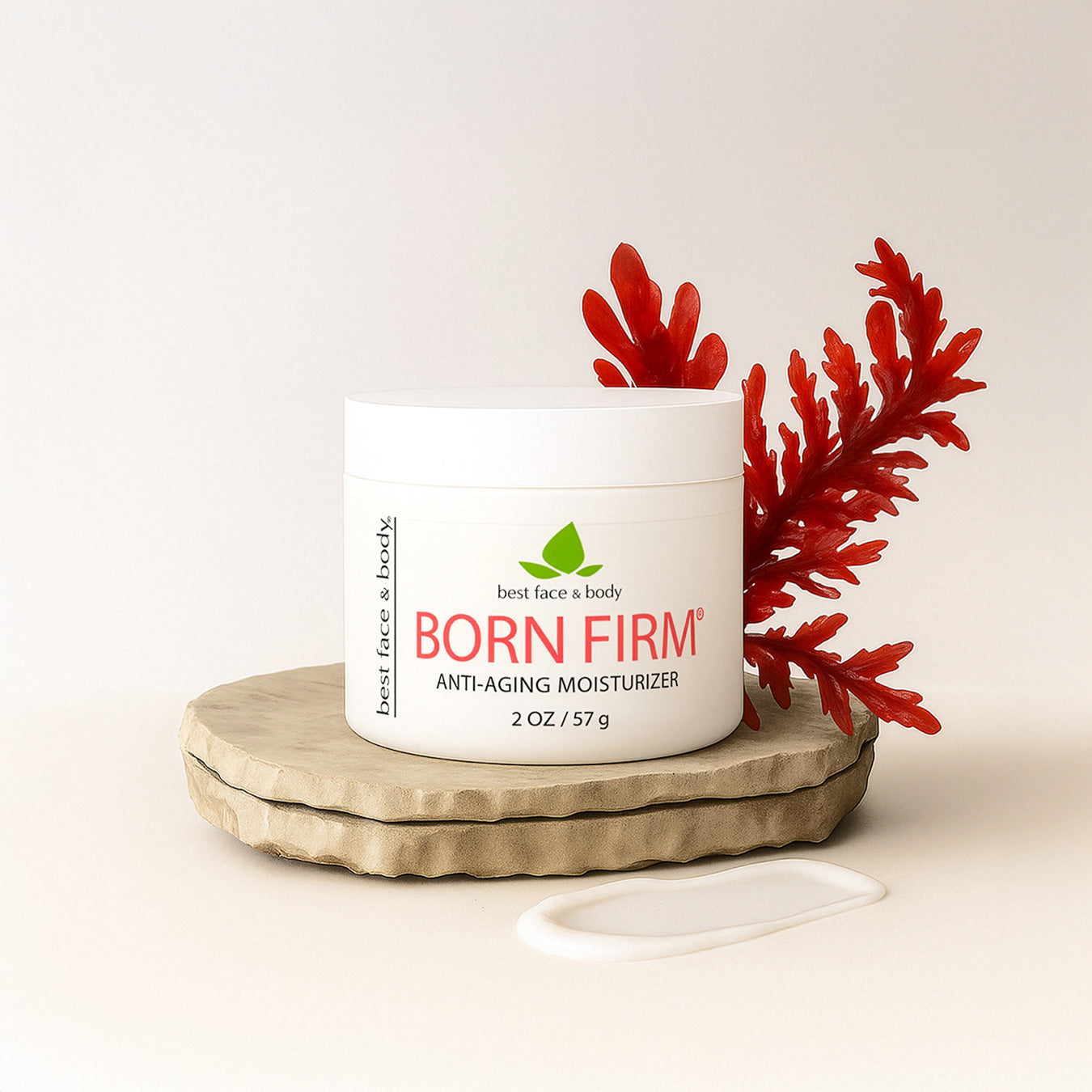 Bottle of 'Born Firm' anti-aging moisturizer on a wooden coaster with red leaves on a light background