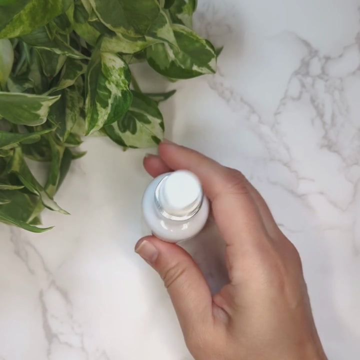 Video demonstration of Advanced Stem Cell Serum applied to skin. The muted orange coloring comes from cocoa and coffee seed extracts.