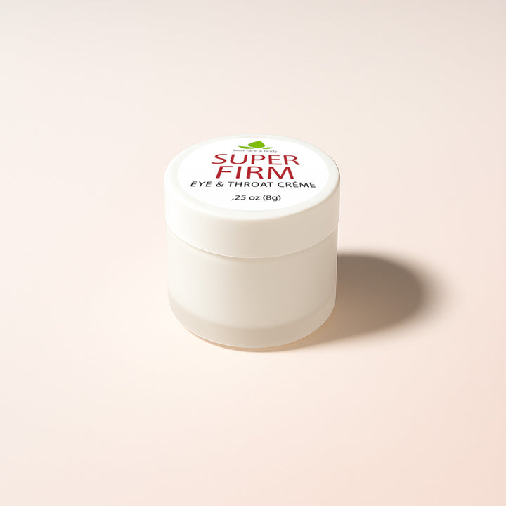 A travel size container of Super Firm Eye & Throat Creme with a 0.25 oz label, predominantly white in color with a logo and text on the lid.