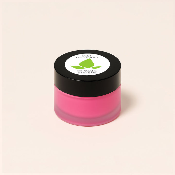 A small cylindrical beauty product shown at an angle on a white marble surface. 