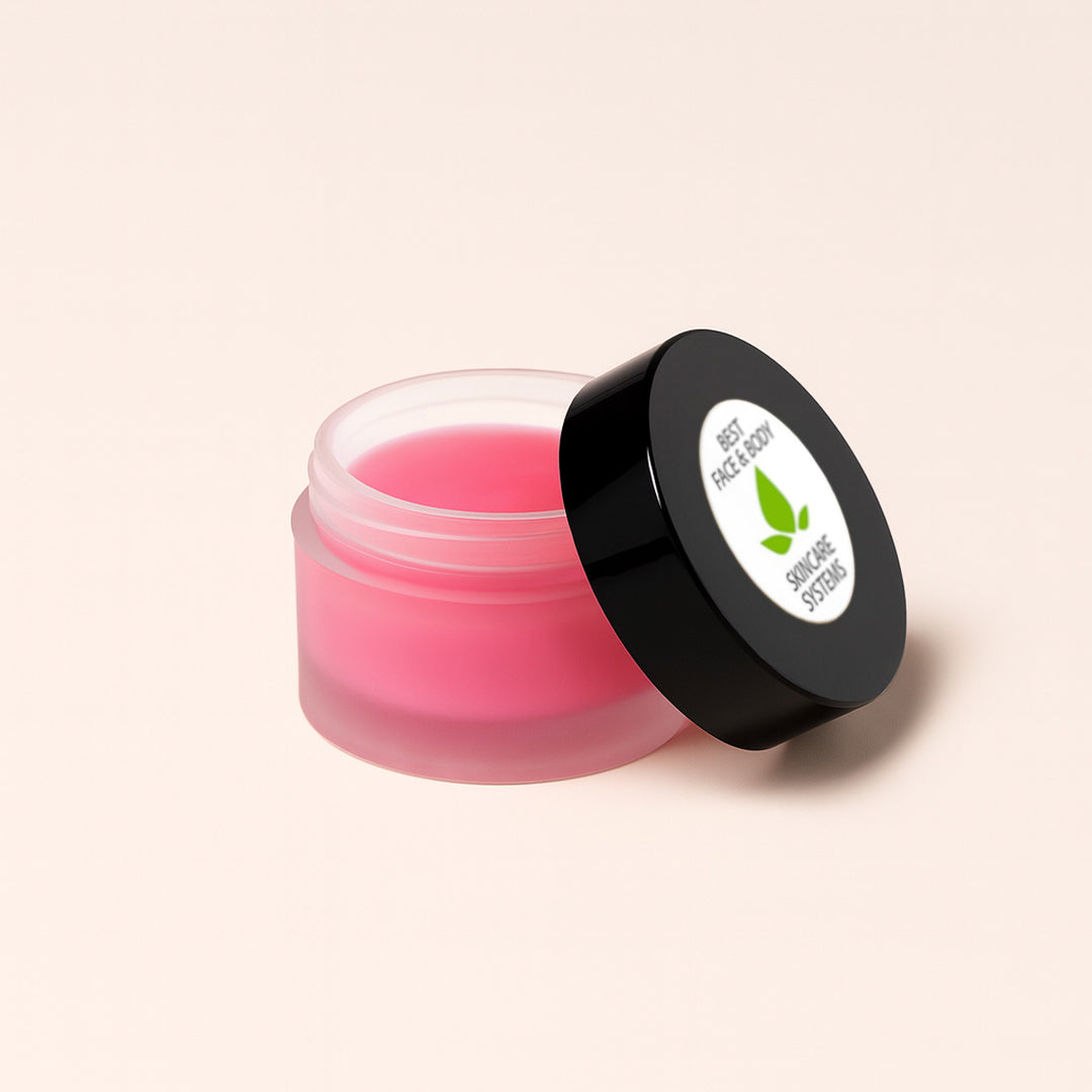 Pink lip balm jar with black lid on a light background