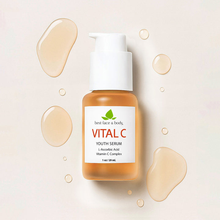 Vital C youth serum bottle with droplets on a beige background