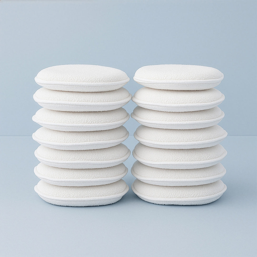 Stacks of white foam bonni pads on a light blue background
