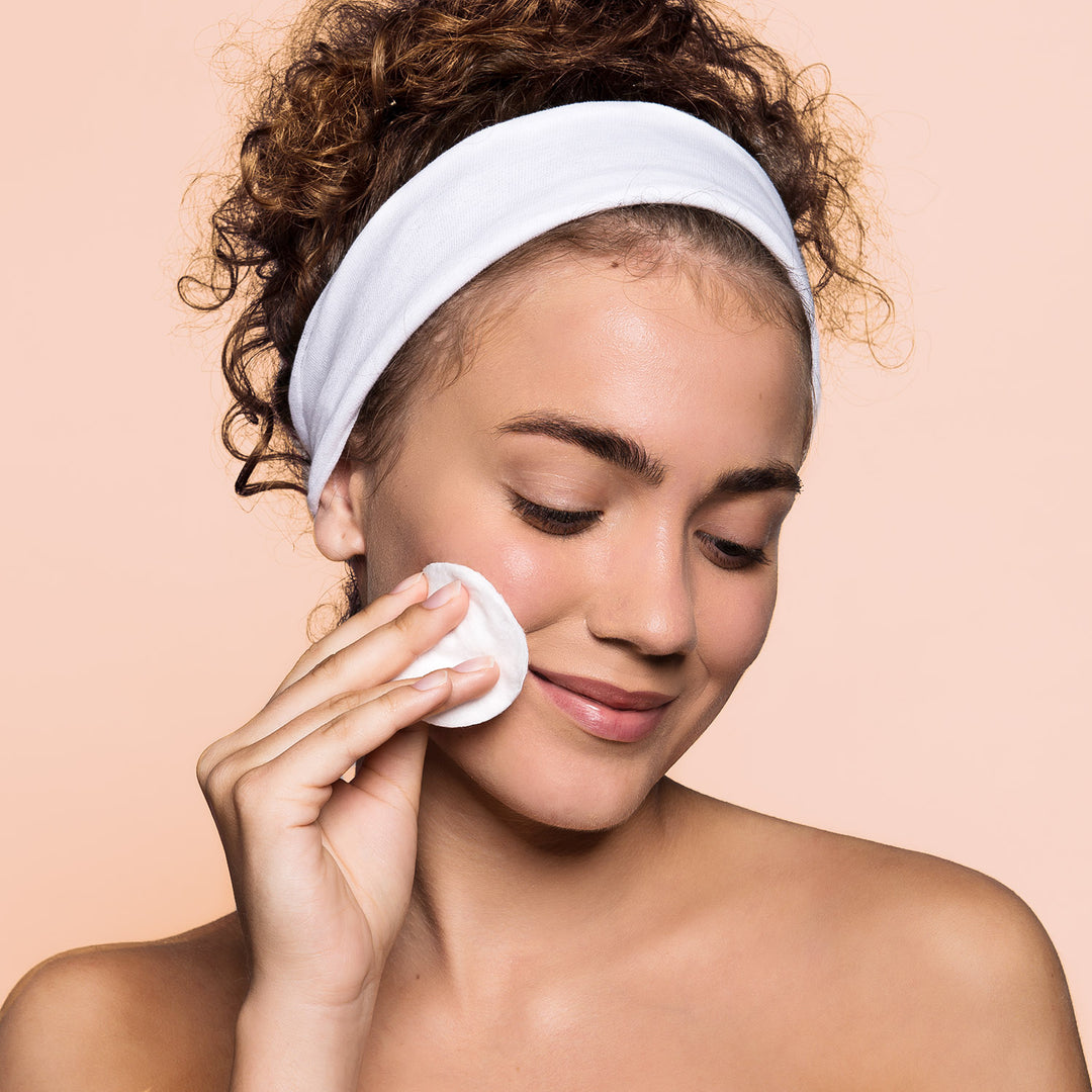 woman applying ginseng toner