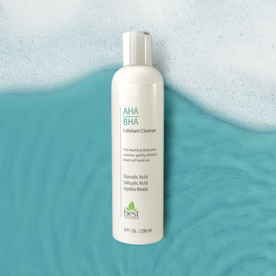 AGA BHA Exfoliant Cleanser. 8oz cosmetic bottle on watery background with foam.